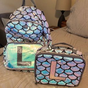 Justice “L” mermaid backpack and lunchbox.